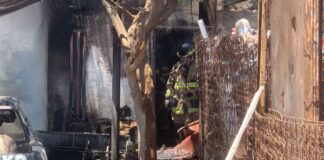Incendio destruye llantera y una vivienda; tres heridos